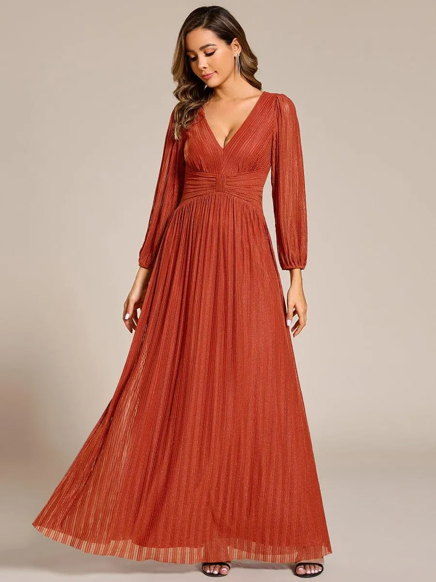 Robe de soirée trapèze à manches longues et taille empire scintillante