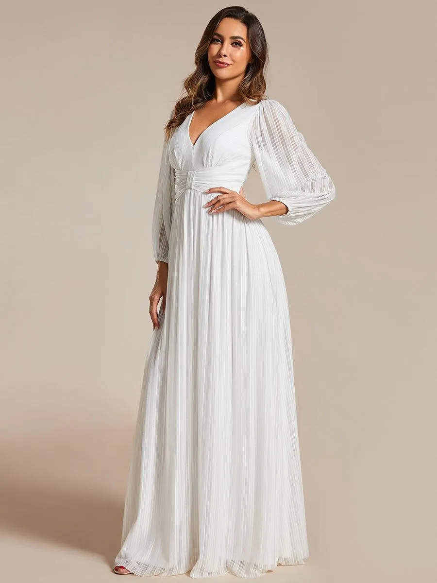 Robe de soirée trapèze à manches longues et taille empire scintillante