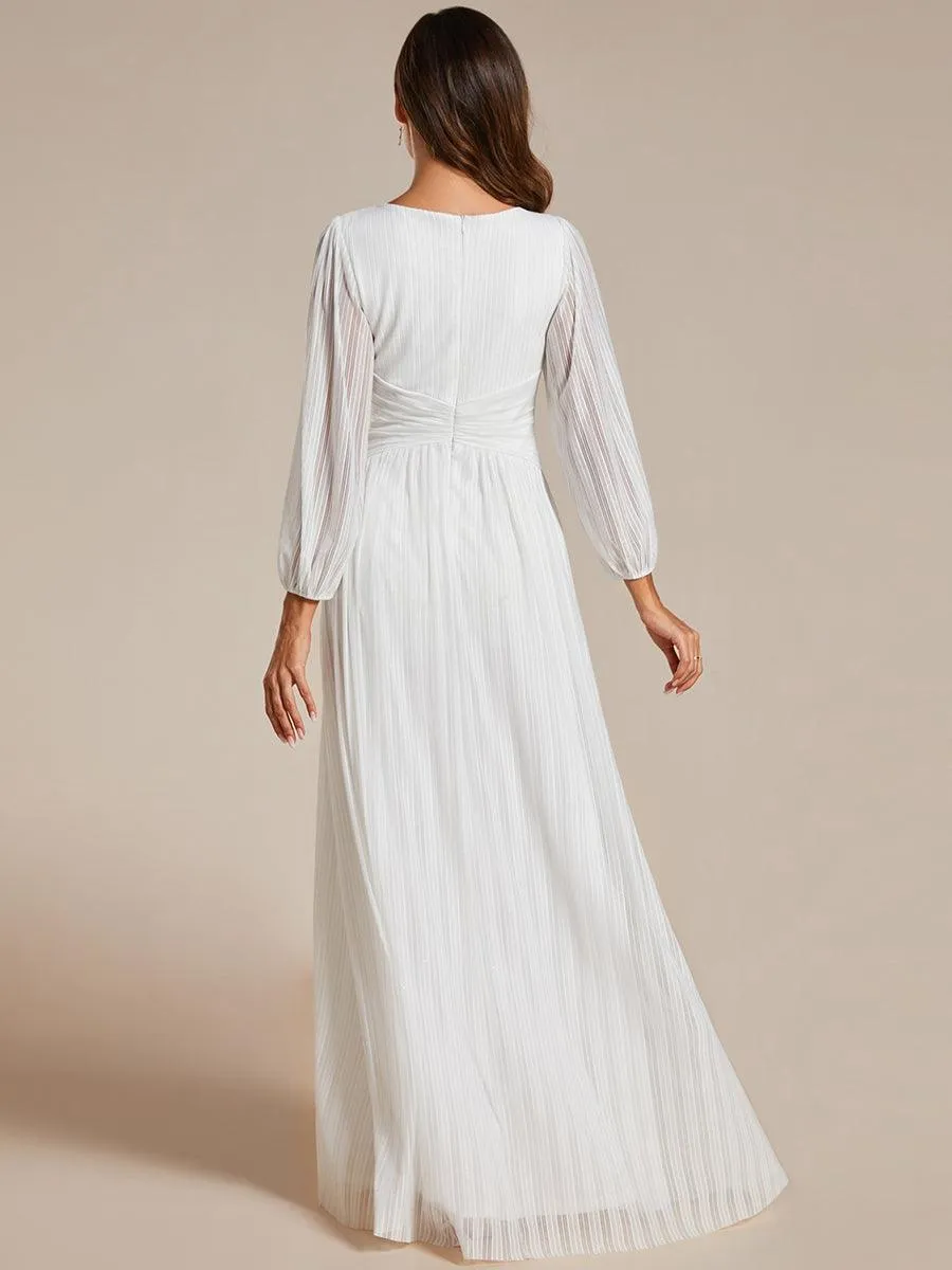 Robe de soirée trapèze à manches longues et taille empire scintillante