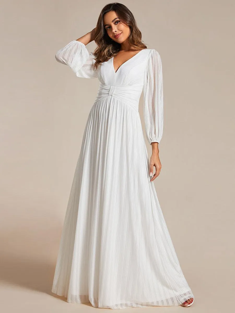 Robe de soirée trapèze à manches longues et taille empire scintillante